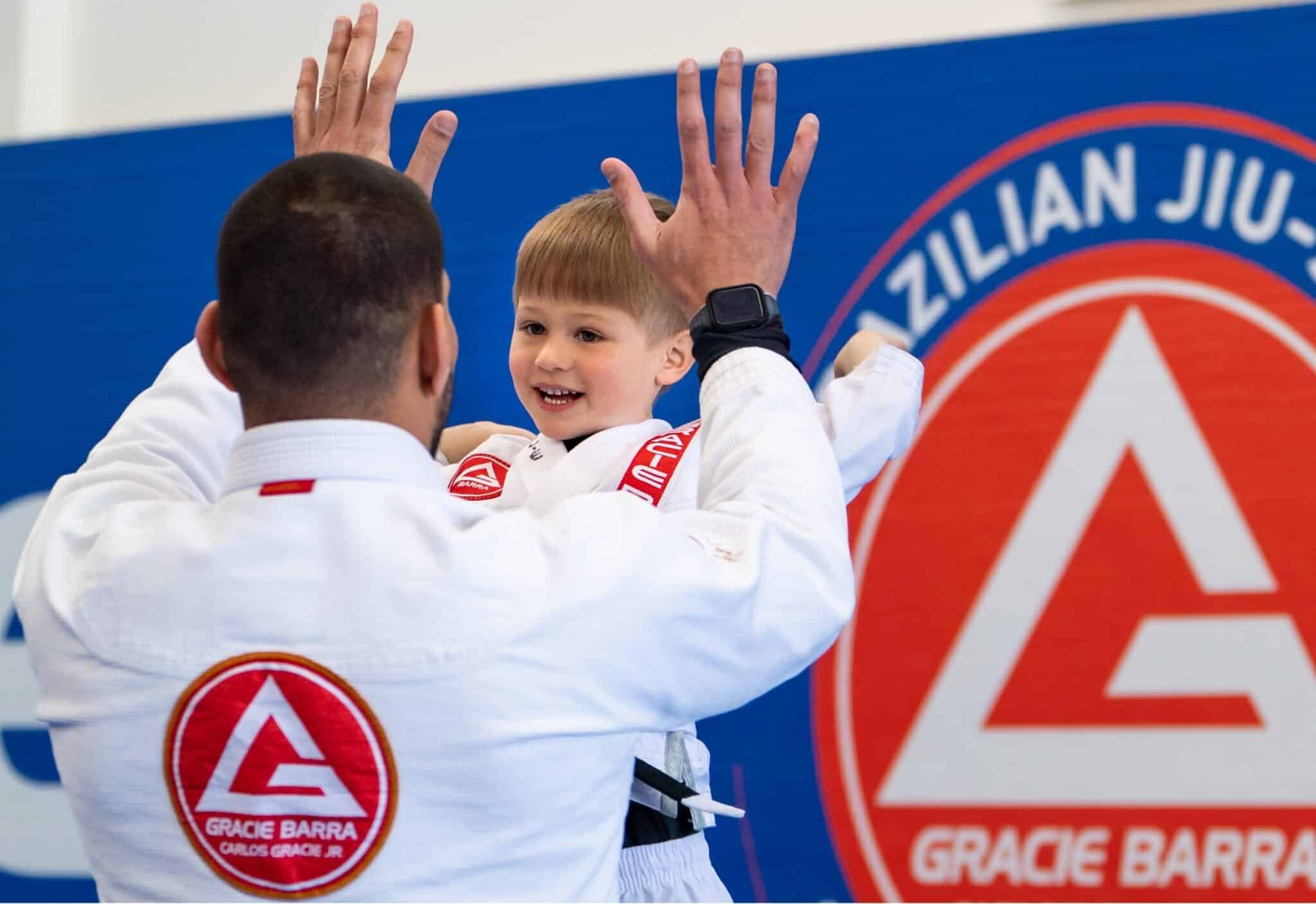 happy child doing brazilian jiu jitsu