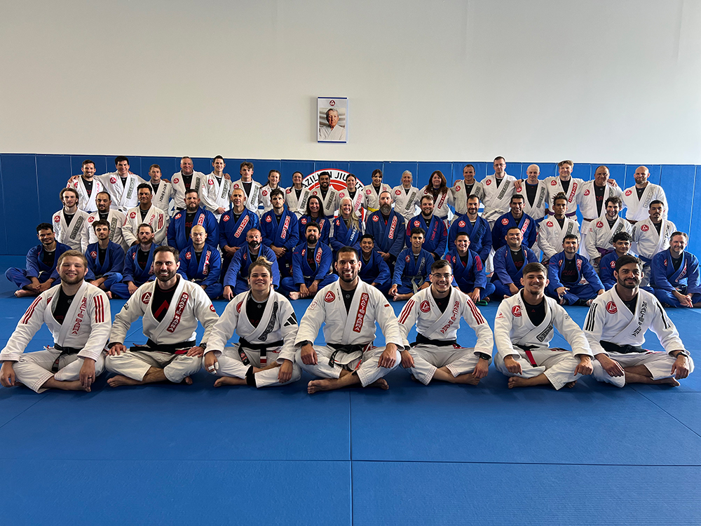 Some of Gracie Barra West Jordan's students sitting and posing to a picture